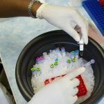 Representative image of a laboratory researcher handling medical samples