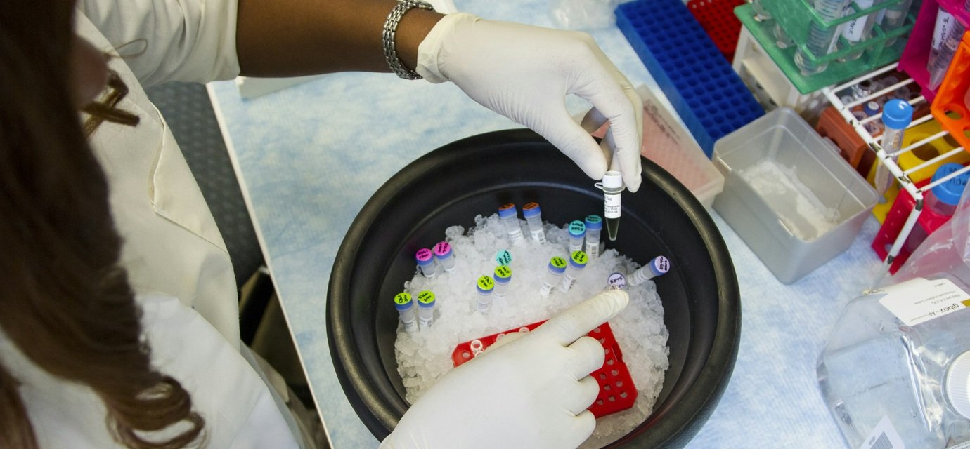 Representative image of a laboratory researcher handling medical samples
