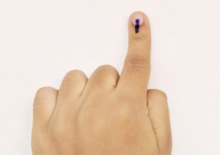 Representative image of a voter showing indelible ink on a finger