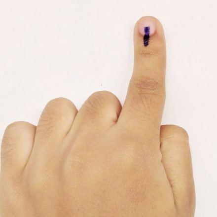 Representative image of a voter showing indelible ink on a finger