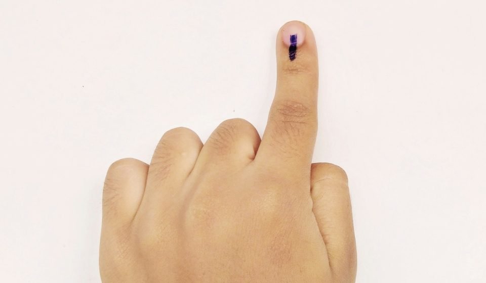 Representative image of a voter showing indelible ink on a finger